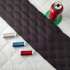 Simili cuir matelassé GEO, 540 g/m², largeur 145 cm, noir avec fil rouge