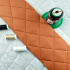 Simili cuir matelassé 5X5 cm, 540 g/m², largeur 145 cm, orange